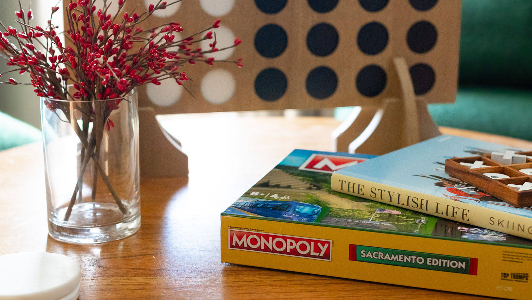 Suite Chalet Table with flowers, monopoly & book