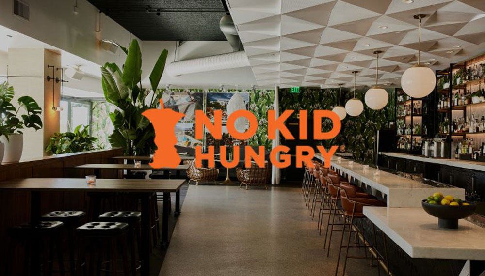 No Kid Hungry logo with restaurant background