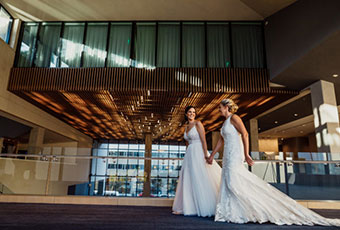 couple holding hands inside the hotel lobby